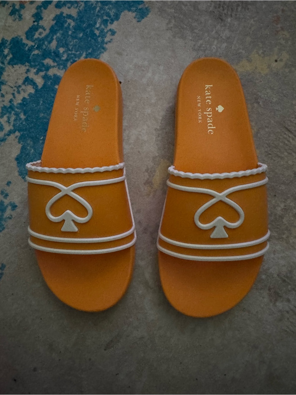 kate spade orange sandals with white trim and spade motif size 10